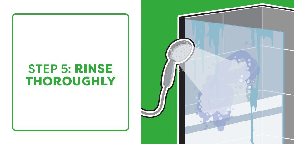 Rinsing shower wall tiles thoroughly to remove soap scum residue