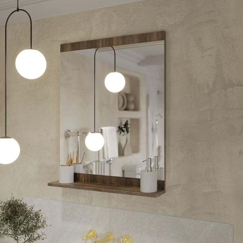 Minimalist bathroom mirror with warm wood accents, soft globe pendant lighting, and simple countertop accessories for a clean, modern look.