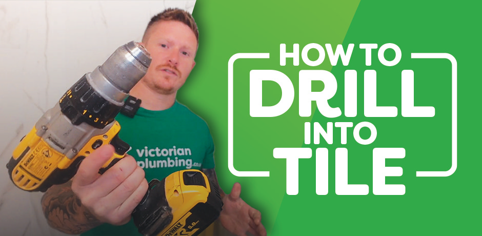 Victorian Plumbing guide cover image featuring a person holding a power drill, with the title 'How to Drill Into Tile' displayed in bold text.