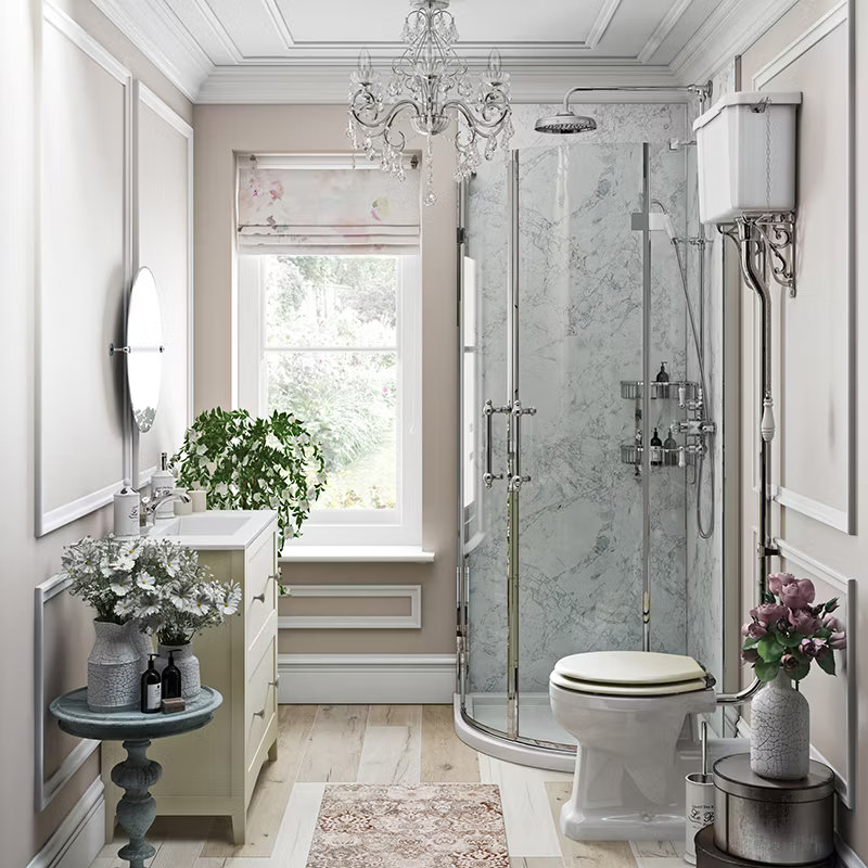 Elegant ensuite bathroom with traditional high-level toilet, corner shower, chandelier lighting, and a vintage vanity unit, featuring classic decor and floral accents.