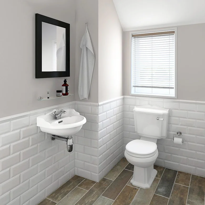 Half tiled bathroom with white metro tiles wrapping around the basin area at half height