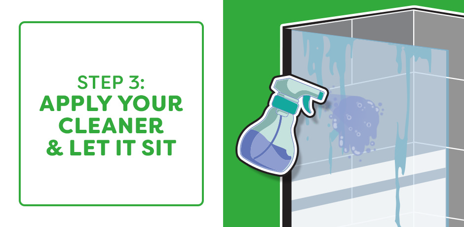 Applying bathroom cleaner to soap scum on shower wall tiles