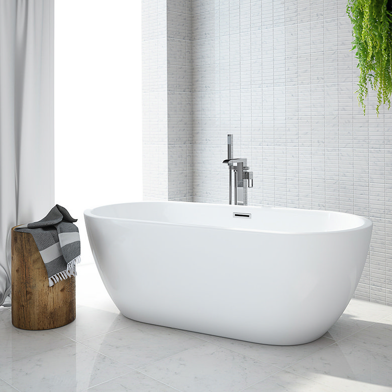 Clean white freestanding bath with floor mounted tap in bright modern bathroom