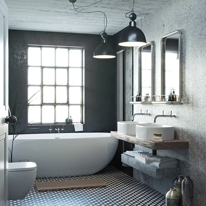 Industrial-style ensuite bathroom with freestanding bathtub, double sinks, large pendant lights, and geometric floor tiles, featuring a modern rustic vanity and large windows.