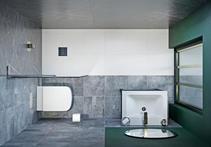 Contemporary wet room with minimalist design, grey tiled walls and floor, and wall-mounted toilet next to a sleek white basin