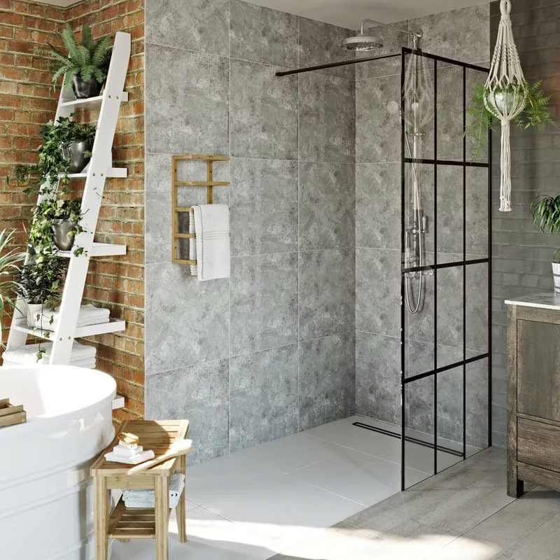 Industrial-style wet room with grey tiles, black grid shower screen, and a rustic wooden ladder shelf for plants and towels