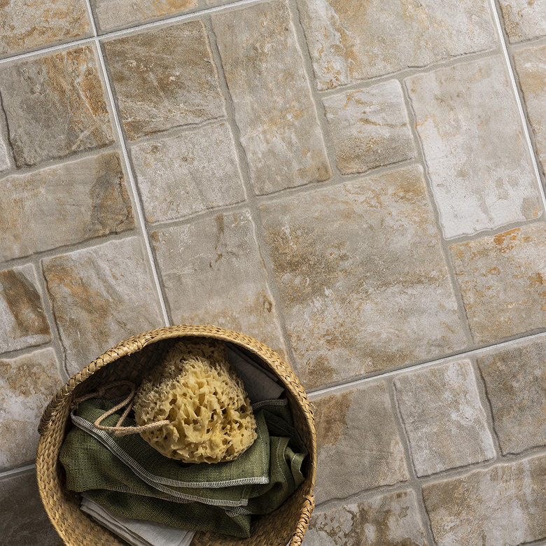 Modular stone effect floor tiles in random ashlar layout for natural bathroom style