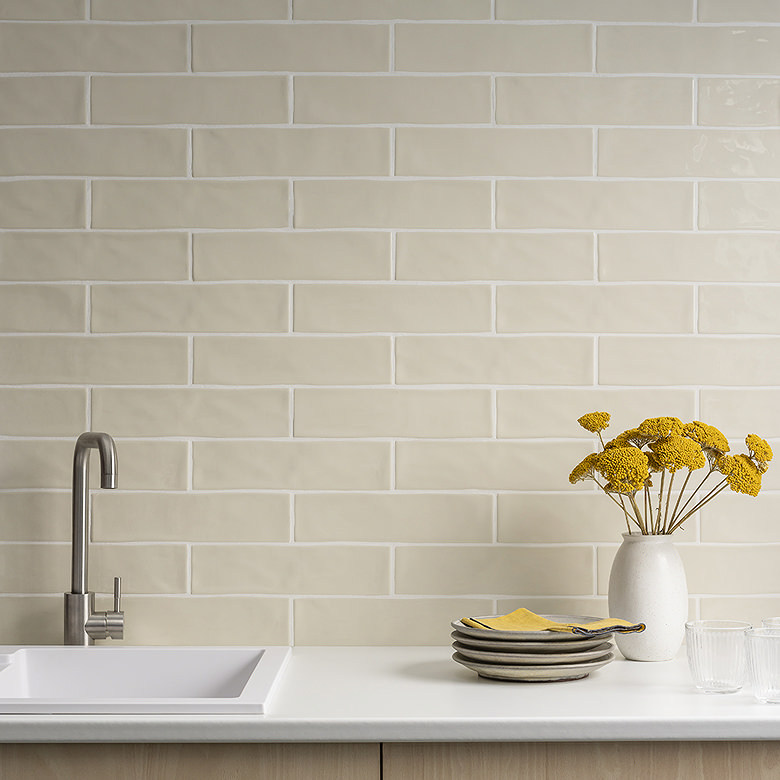 Warm white metro tiles with subtle handmade texture.