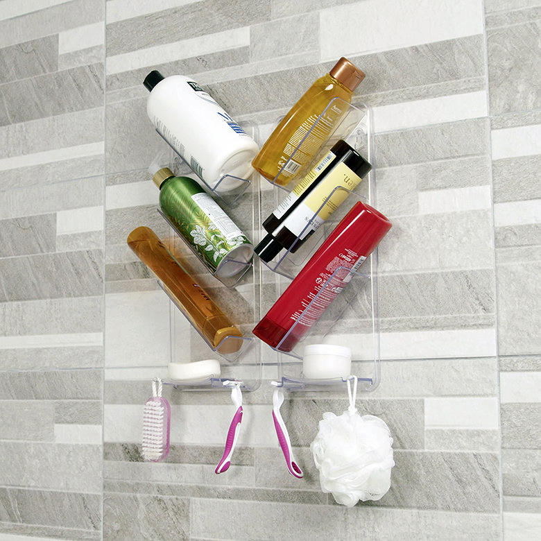 Clear no-drill shower caddy holding bottles and hanging accessories in a small shower