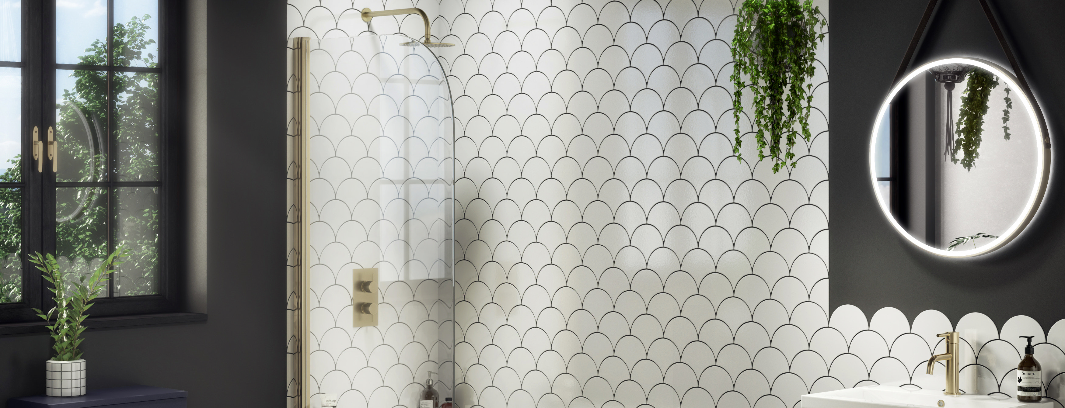 Frameless fixed bath screen with matt black profile and rainfall shower set against grey stone-effect wall tiles