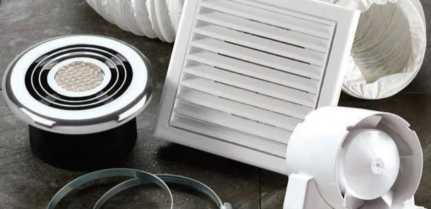 Various bathroom extractor fan components, including vents and ducting, used to remove moisture and improve airflow.