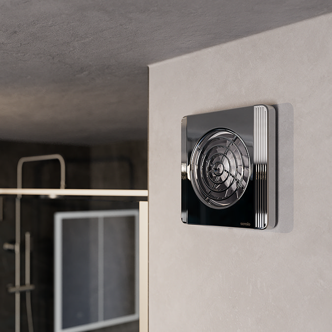 Modern chrome bathroom extractor fan mounted on a wall, designed to efficiently reduce moisture and enhance ventilation in stylish bathroom settings.