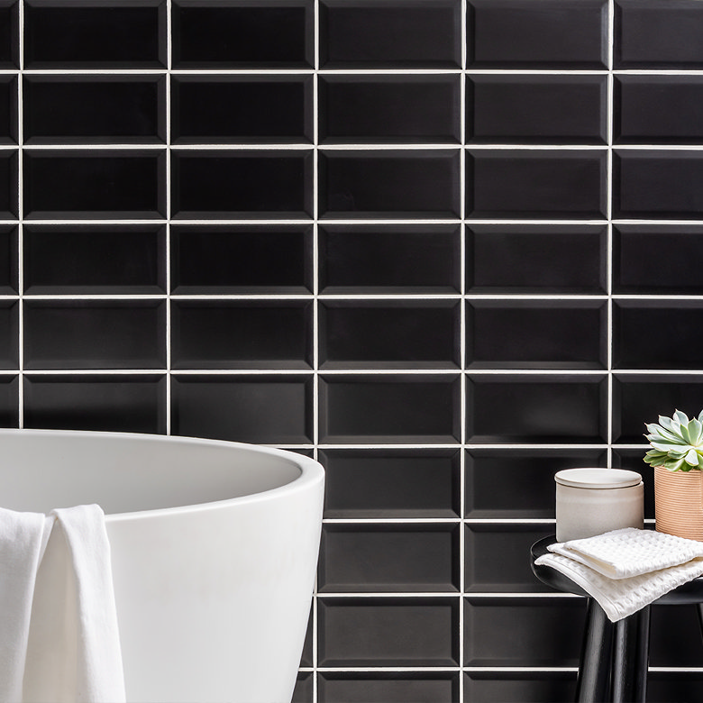 Horizontal stack tile layout with black rectangular tiles creating modern bathroom wall tile design