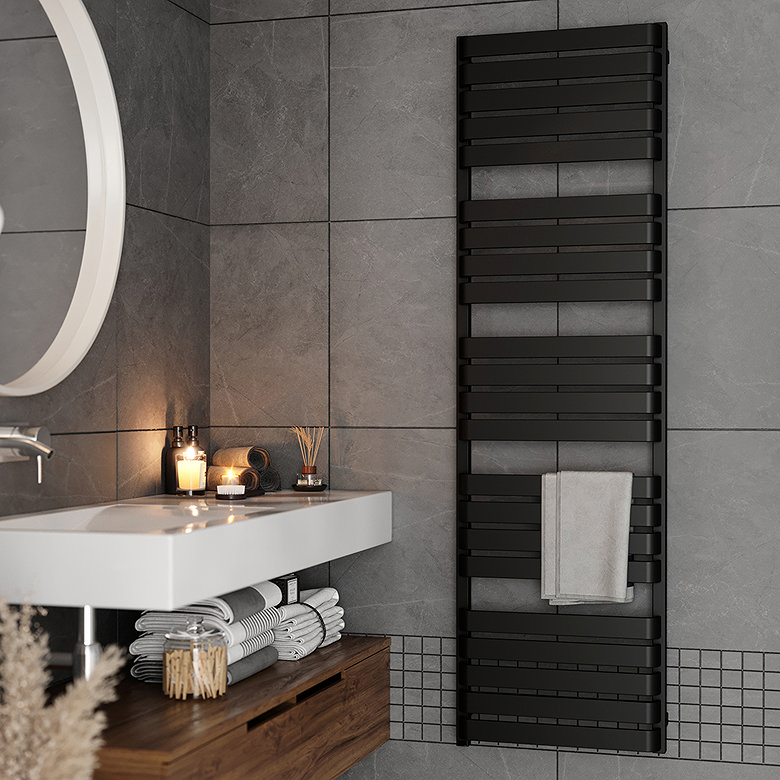 Modern grey tiled bathroom with floating vanity, round mirror and black heated towel rail