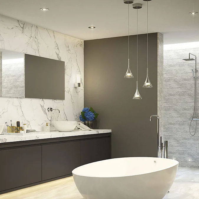 Luxurious bathroom with marble accents, a freestanding bathtub, sleek pendant lights, and a modern walk-in shower, creating a spa-like ambiance.