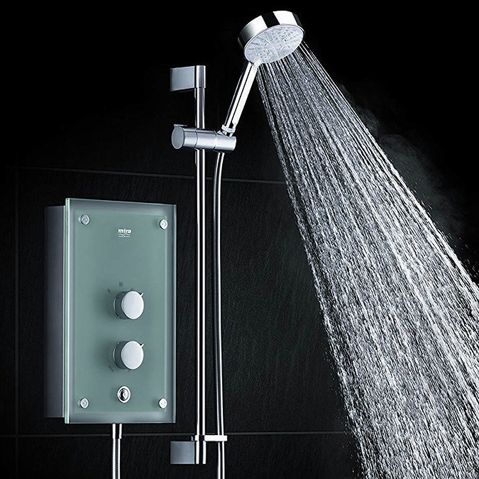 Mira thermostatic electric shower with chrome adjustable handheld shower head and glass control panel, water spraying