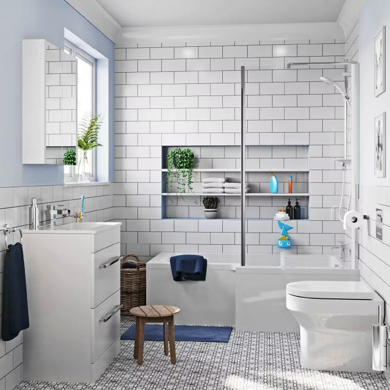 Modern white bathroom with a bathtub, integrated shower, and subway tile walls. Includes shelving with plants and neatly arranged towels for added storage.