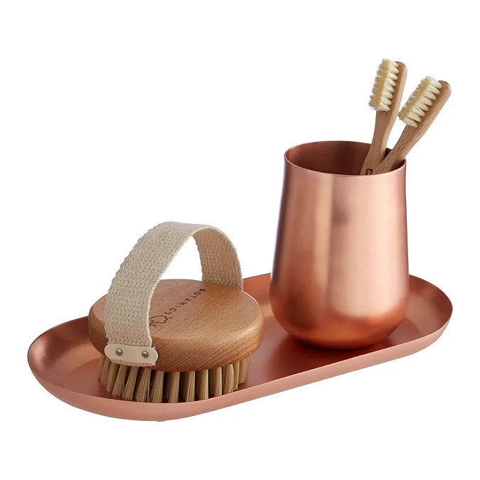 Copper bathroom tray with toothbrush holder and exfoliating body brush
