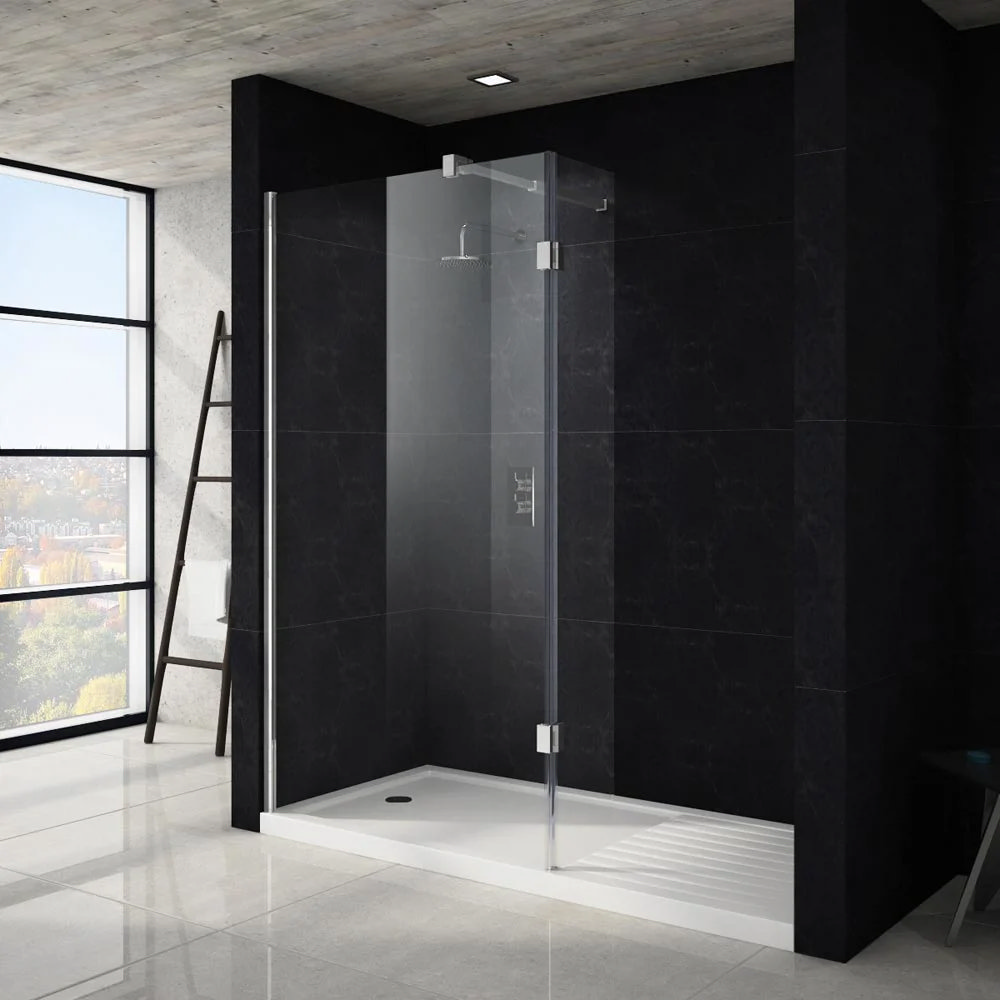 Modern wet room featuring a sleek glass shower enclosure with chrome fixtures and a rainfall showerhead. The contrast of black marble-effect tiles and light grey flooring adds a luxurious touch, while large windows flood the space with natural light.