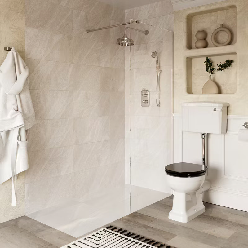 Classic bathroom featuring a luxurious walk-in shower with chrome fixtures and a traditional high-level toilet, complemented by neutral tiles and built-in shelving.