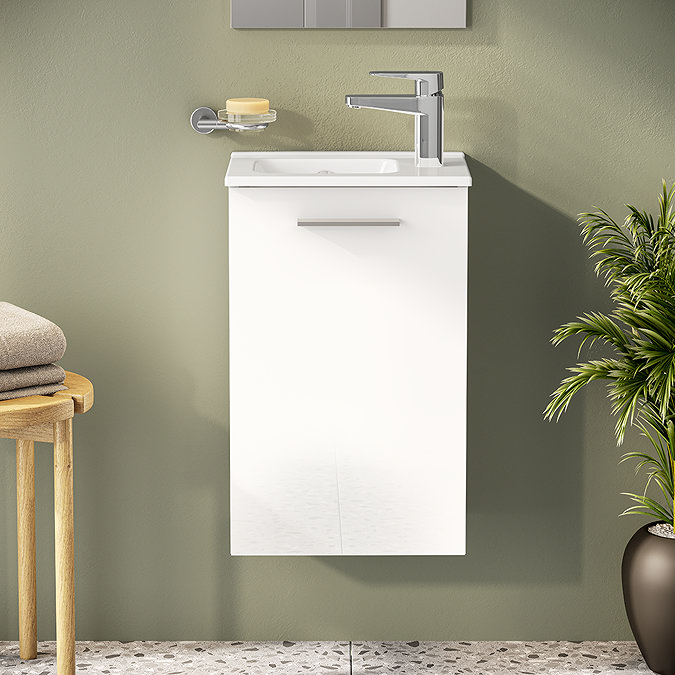 Slim white wall-mounted vanity with small rectangular basin and chrome mixer tap.