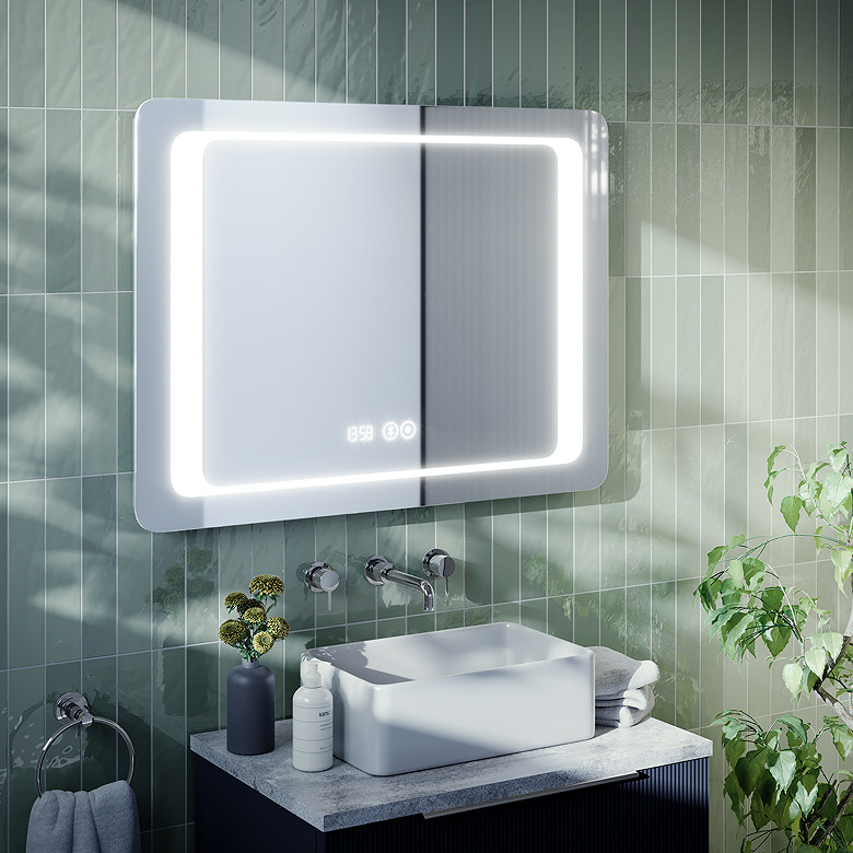 Modern bathroom featuring LED mirror cabinet with digital display, green tiled walls and wall-mounted basin tap