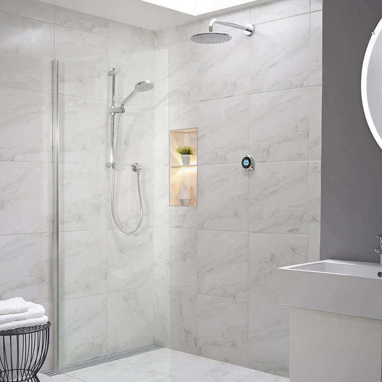 Modern walk-in shower with marble-effect wall tiles, rainfall shower head, handheld shower and built-in illuminated niche