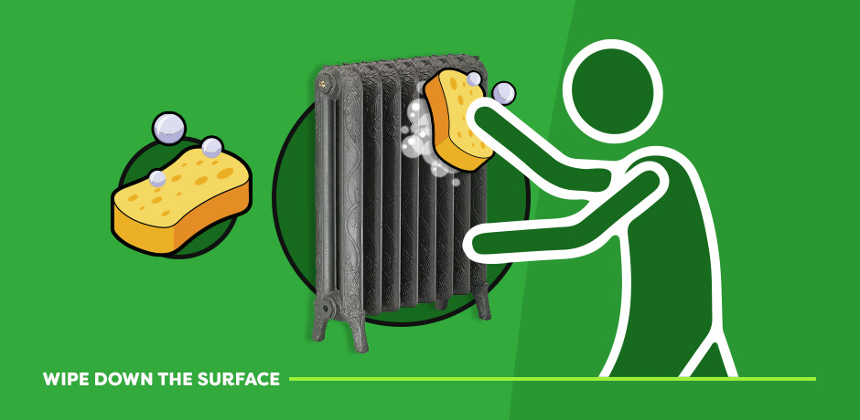 Wiping down a radiator with a sponge and soapy water to clean the surface