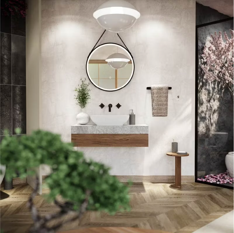 Japandi bathroom vanity area featuring a round hanging mirror, minimalist vessel sink on a wood and stone countertop, and soft lighting. A blend of Japanese simplicity and Scandinavian functionality with neutral tones and natural textures.