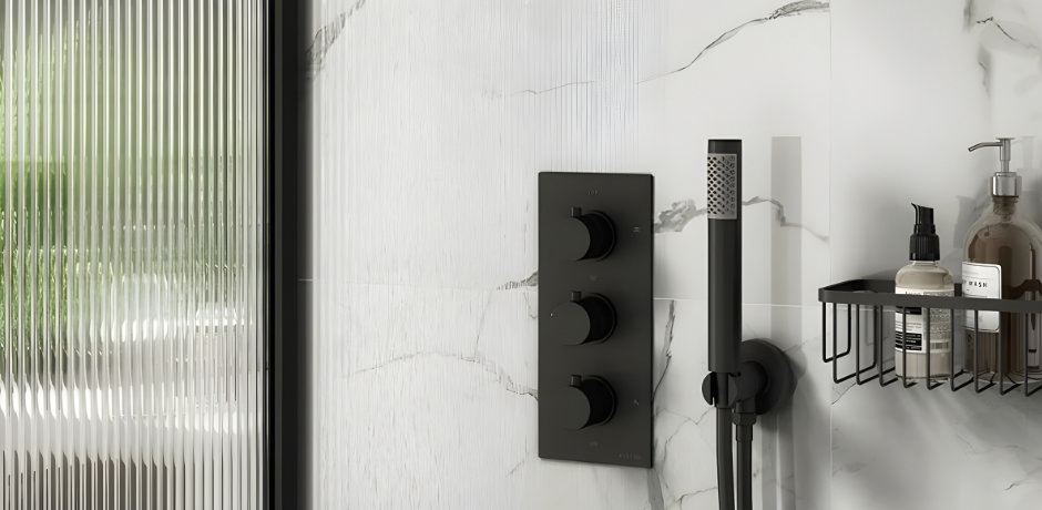 Slim black wall mounted shower shelf positioned beside black mixer controls in a small shower