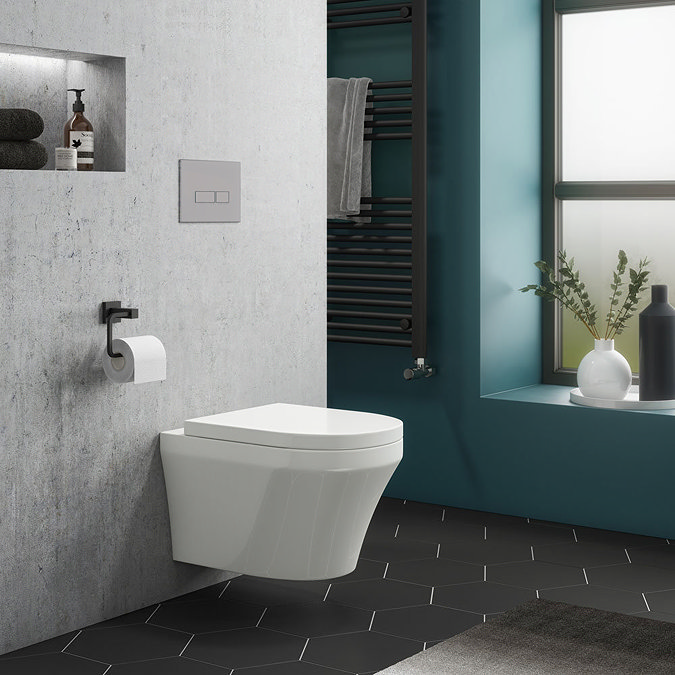 Minimalist bathroom with a wall-mounted toilet, recessed shelving, matte black heated towel rail, and bold teal accent wall.