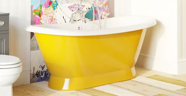 Freestanding yellow bathtub with a modern, vibrant finish, creating a bold focal point in a colourful bathroom with contemporary artwork on the wall.