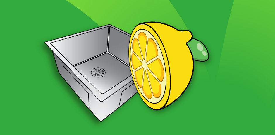 Using a lemon to scrub a stainless steel sink for cleaning and sanitising