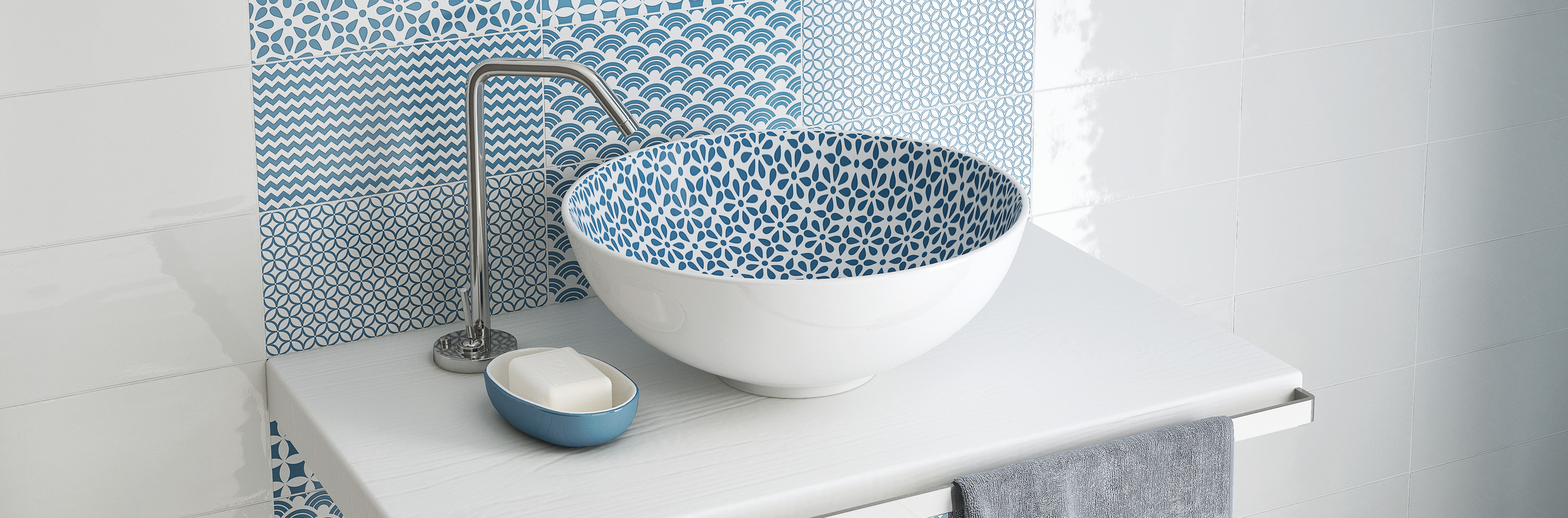 Modern white round countertop basin with a minimalist design, paired with a black tall basin tap, set on a dark vanity with bathroom accessories.