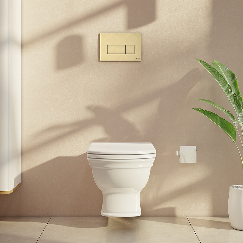 Wall-hung toilet with beige bathroom walls, concealed cistern and brass flush plate