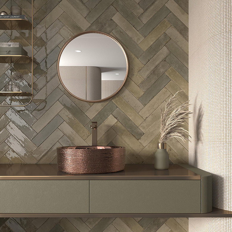 Herringbone tile pattern with stone effect rectangular tiles in modern bathroom wall design