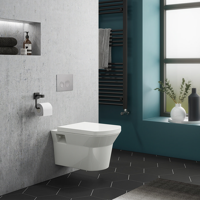 Modern Bathroom with a Stylish Wall-Hung Toilet, Matte Black Accessories, and Geometric Tile Flooring.