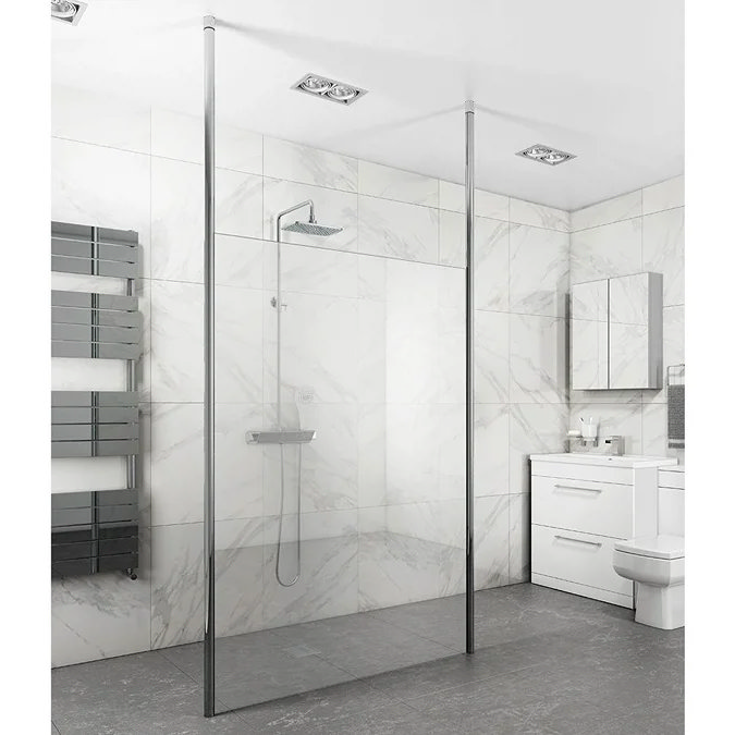 Sleek modern wet room featuring a frameless glass shower screen, large white marble-effect tiles, and grey floor tiles for a minimalist, contemporary look. Includes a chrome rainfall shower and wall-mounted towel radiator.