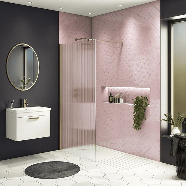 Fluted shower screen with pink tiles and black walls