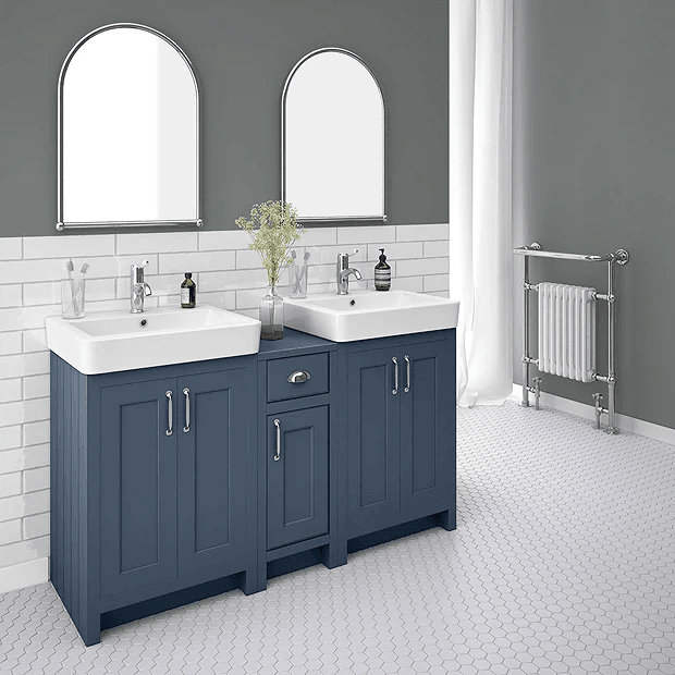 Blue double vanity unit in grey bathroom with white tiles