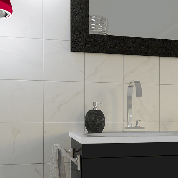 Square marble tiles and black vanity unit with chrome tap