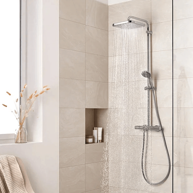 Chrome shower with beige tiles