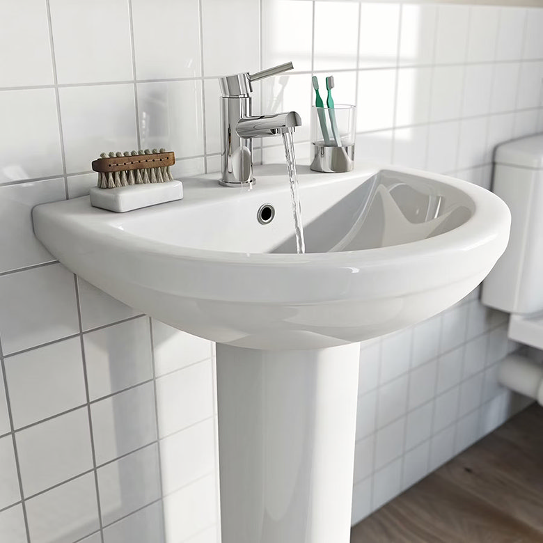 white pedestal sink, white tiles