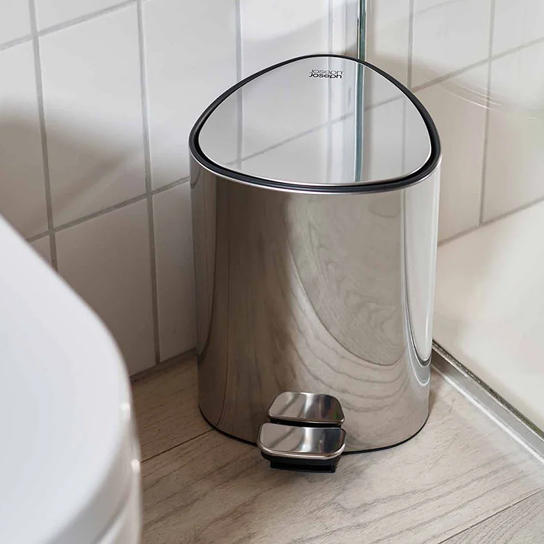 chrome pedal bin in light bathroom
