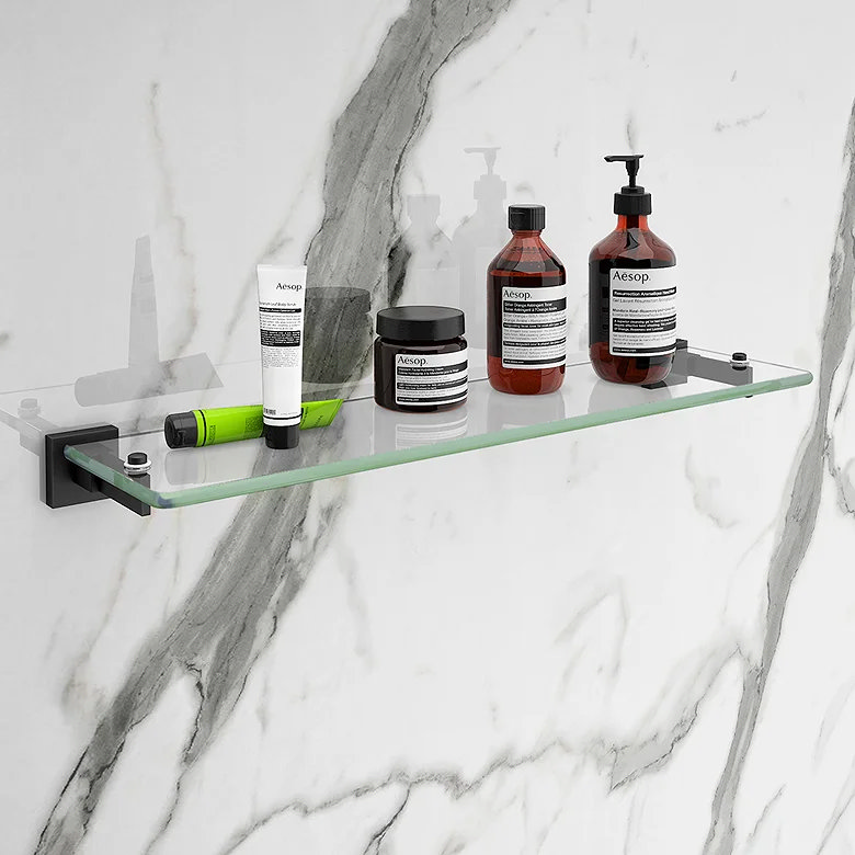 glass and matt black shelf on marble wall
