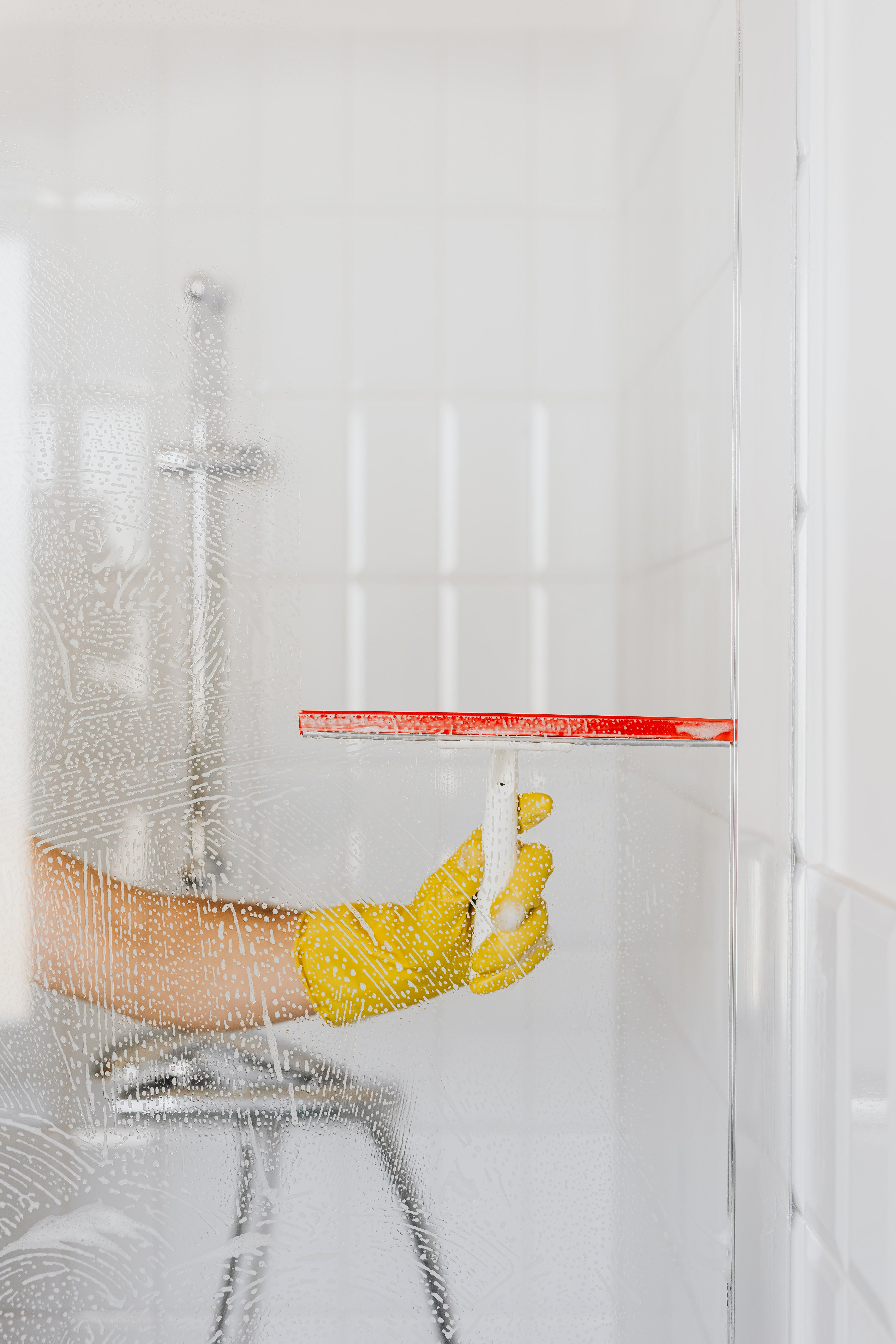 squeege on shower screen to rinse off excess water