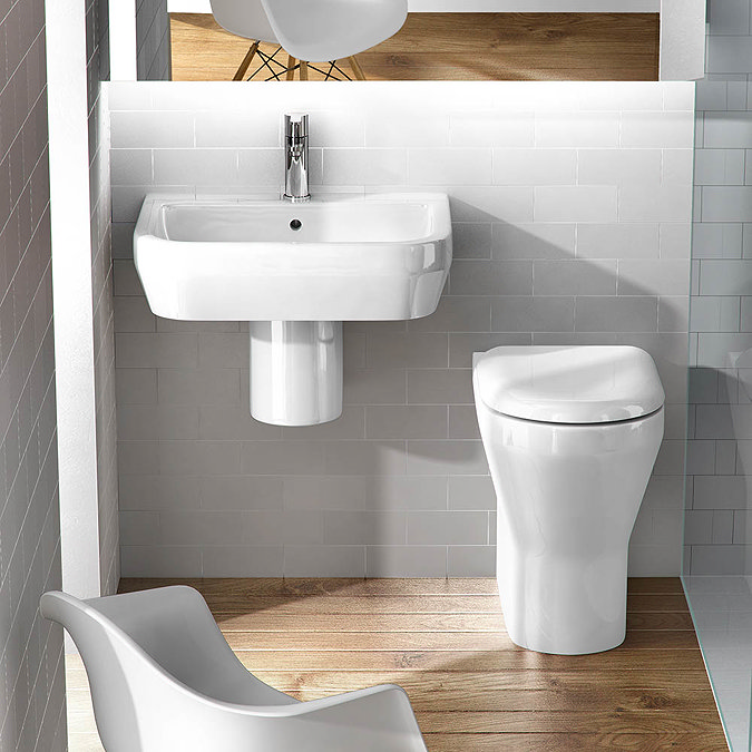 Britton Bathrooms - Curve Washbasin with round semi pedestal - 2 Size Options  Standard Large Image