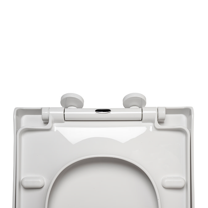 Top-down, close-up image of the underside of the Croydex Ascona D-Shaped Toilet Seat, focusing on the hinges.