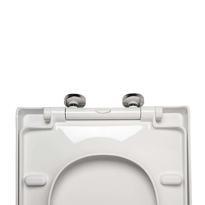 Top down, close-up view of the underside of the seat, showing the hinges and fixings in greater detail, pictured on a white background.