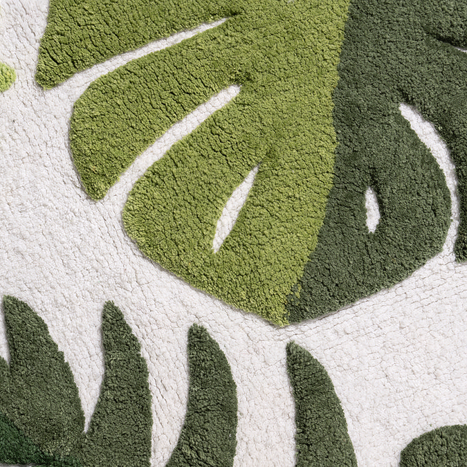 Close up detail of the botanical design of the Croydex Botanical Soft Tufted Bath Mat, pictured on a white background.